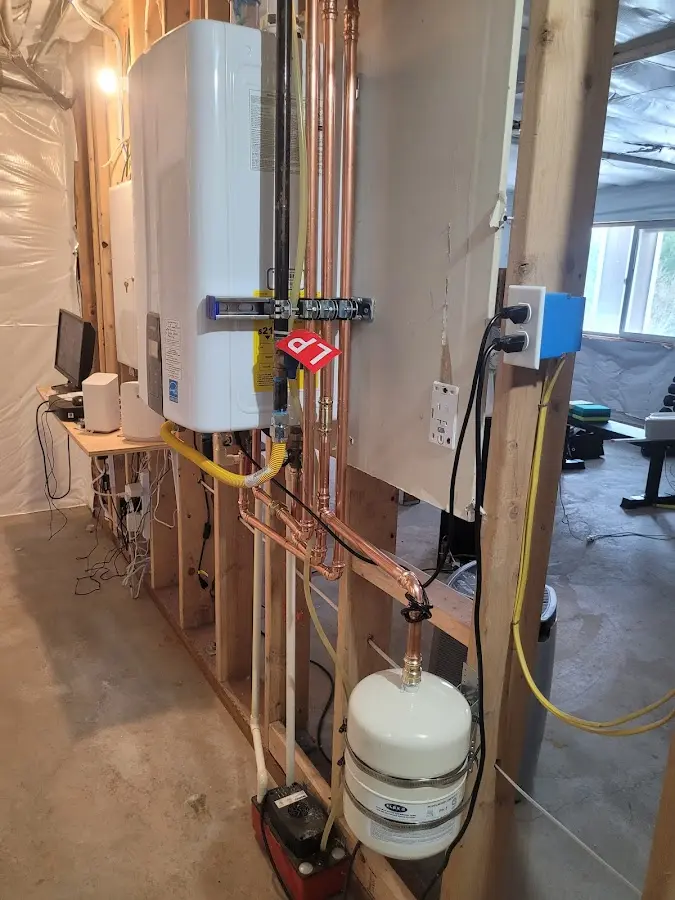 Licensed plumber repairing a kitchen sink in Benton